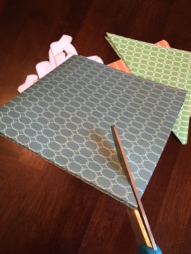 Cutting diagonally across folded paper