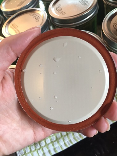 The rubber seal is intact, but there's a big dent across the lid. Throw it out!