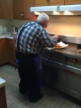 My grandpa making his famous fish fry.