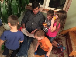 My uncle reading to his great-nieces and -nephews.