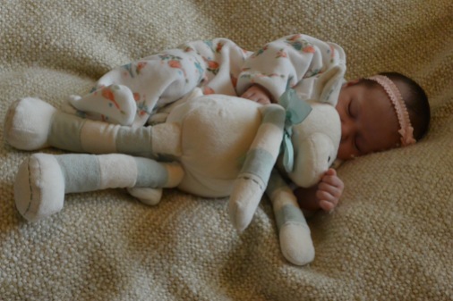 Sound asleep with Lambie, at one month old.